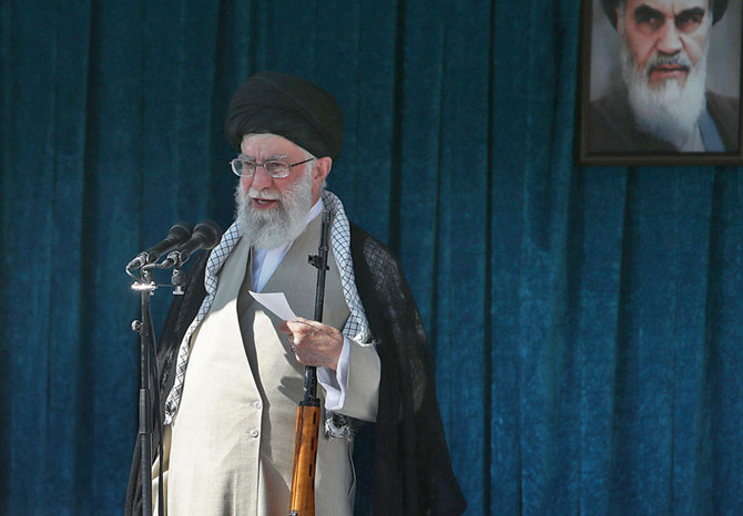 /news/ira....Khamenei-holds-a-rifle.jpg